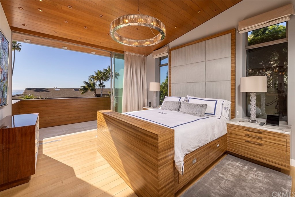 2538 Monaco Drive Laguna Beach, CA 92651 - Photo 14 of 26 a spacious bedroom with a bed and ceiling fan