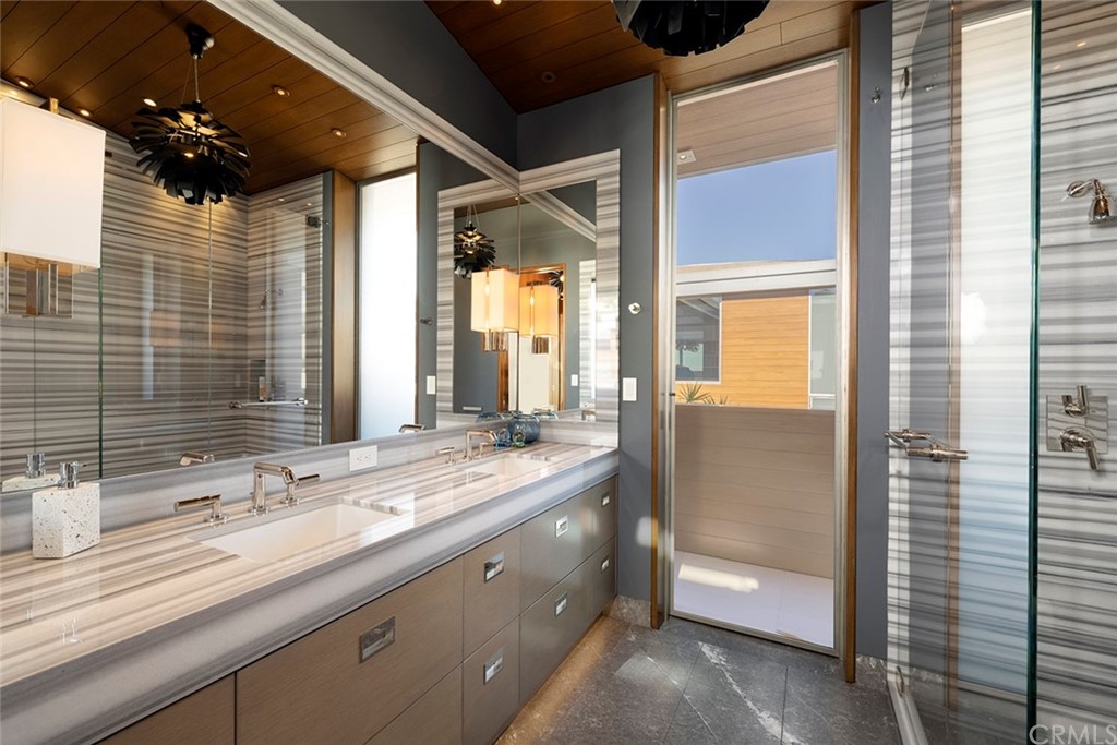 2538 Monaco Drive Laguna Beach, CA 92651 - Photo 19 of 26 a bathroom with a double vanity sink and mirror