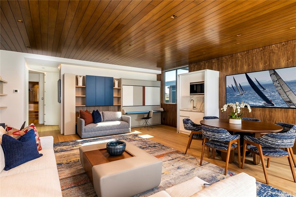 2538 Monaco Drive Laguna Beach, CA 92651 - Photo 23 of 26 a living room with furniture a fireplace and a table