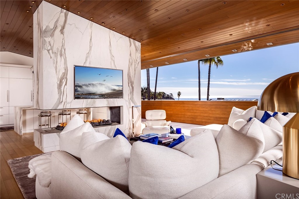 2538 Monaco Drive Laguna Beach, CA 92651 - Photo 7 of 26 a living room with fireplace furniture and a flat screen tv