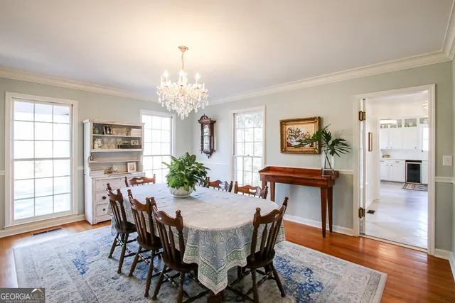 a kitchen with stainless steel appliances granite countertop a stove sink and cabinets
