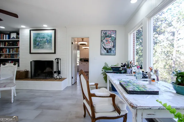a view of a livingroom with furniture and a window
