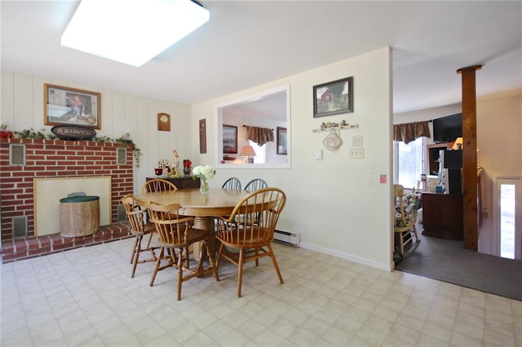 1 Wood Pond Road Brunswick, ME 04011 - Photo 8 of 31 Eat in kitchen. Fireplace is...