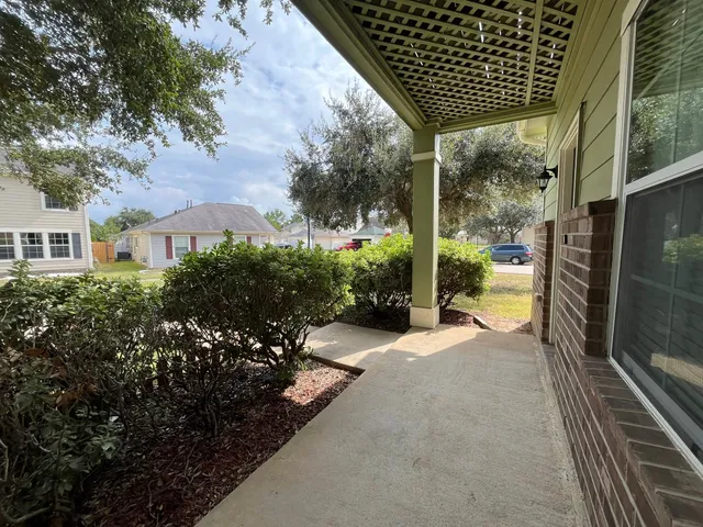 a view of a chairs and table in the balcony