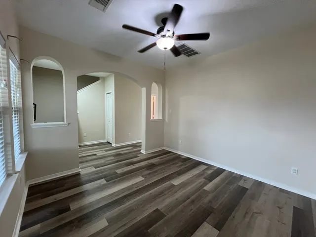 a bathroom with a sink toilet and a mirror
