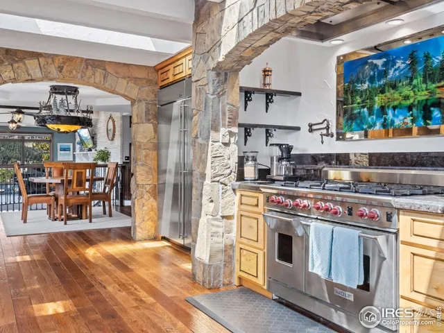 a kitchen with a stove a sink and a counter top space