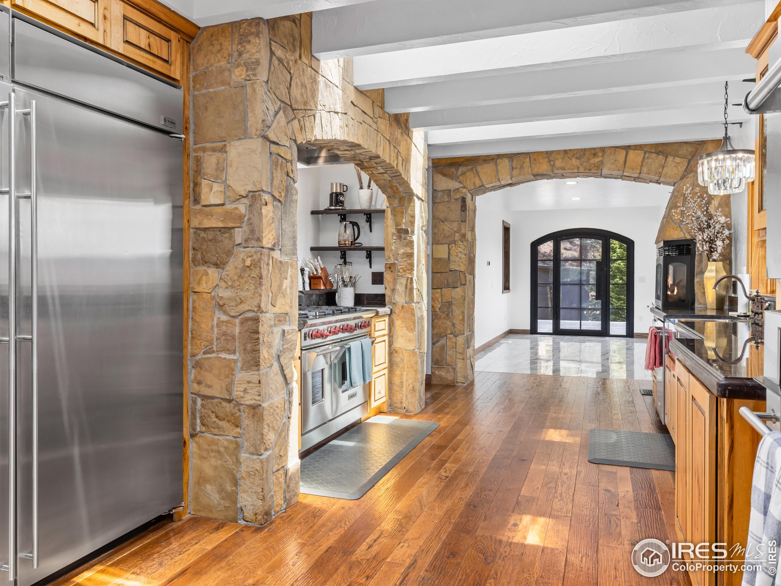 2701 Fall River Road Estes Park, CO 80517 - Photo 12 of 40 a living room with stainless steel appliances furniture a rug and a large window