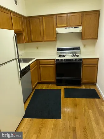 a kitchen with a sink and a stove