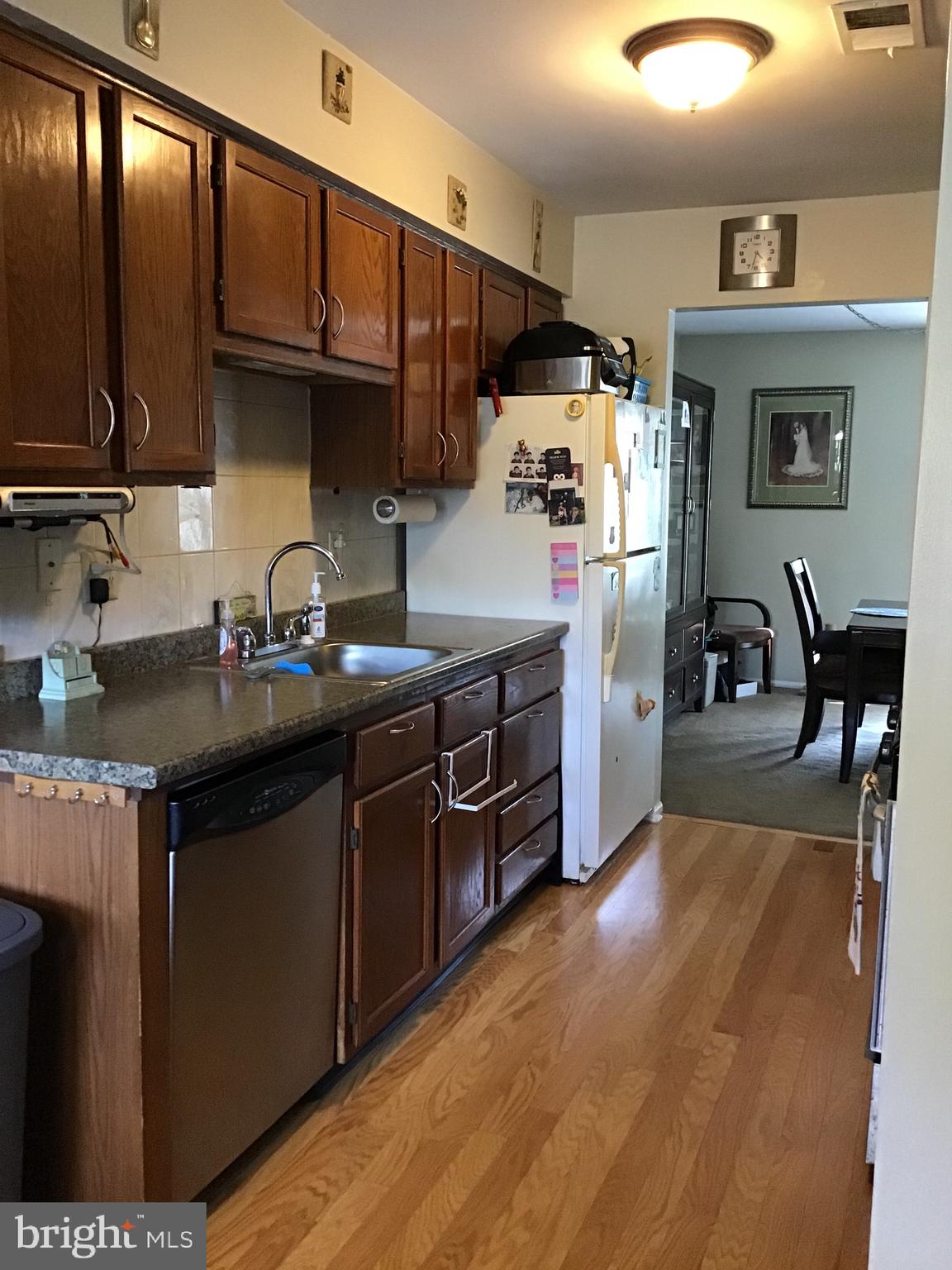 27 Stratton Court Trenton, NJ 08691 - Photo 6 of 21 a kitchen with stainless steel appliances granite countertop a sink a stove and a refrigerator