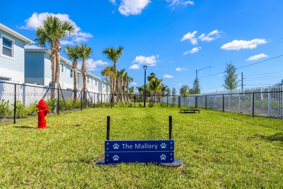 3645 Blue Fin Way, Unit 101 Fort Myers, FL 33916 - Photo 2 of 8 a view of a house with a yard