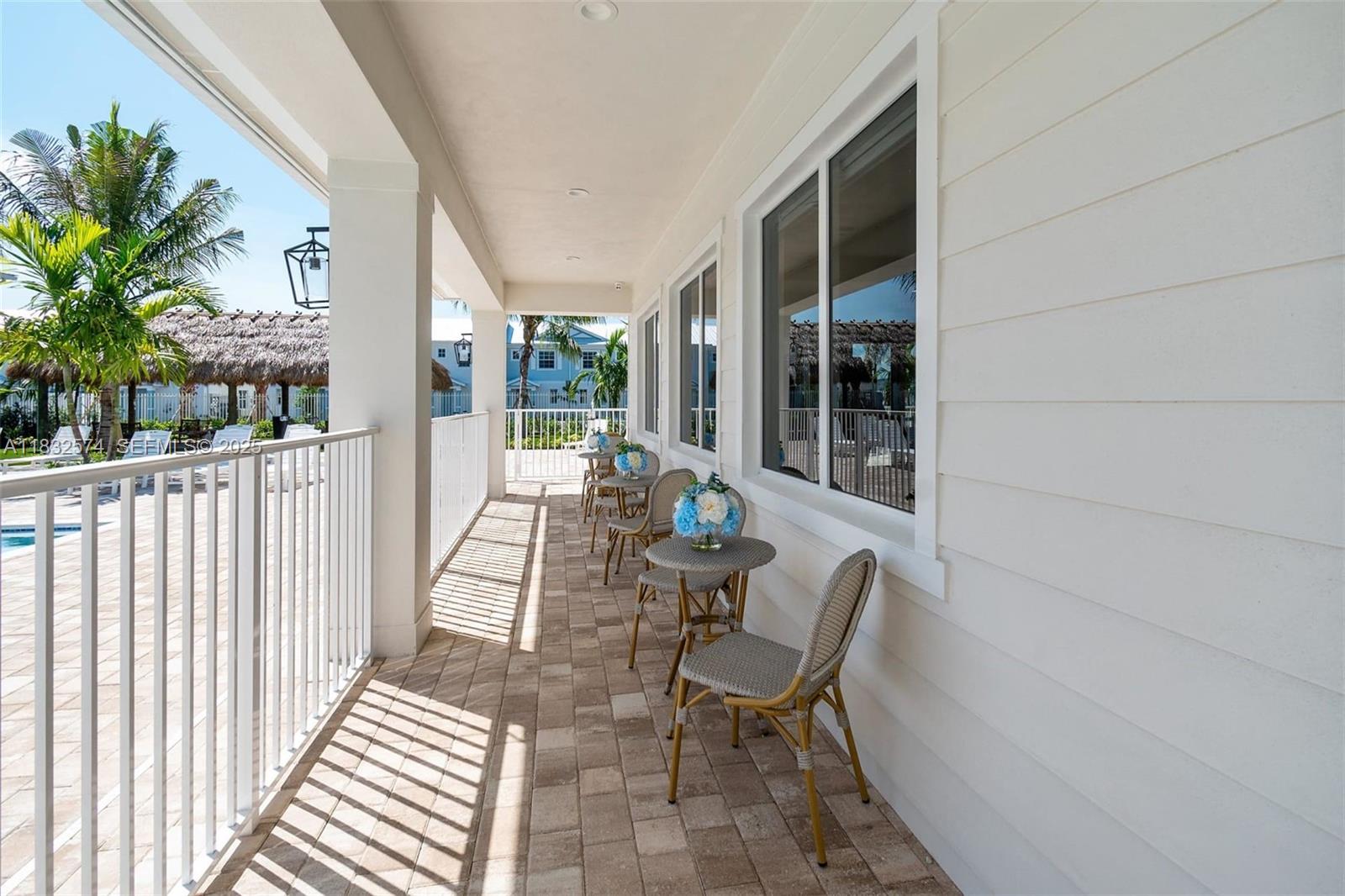 3645 Blue Fin Way, Unit 101 Fort Myers, FL 33916 - Photo 8 of 8 a view of a patio with table and chairs and potted plants