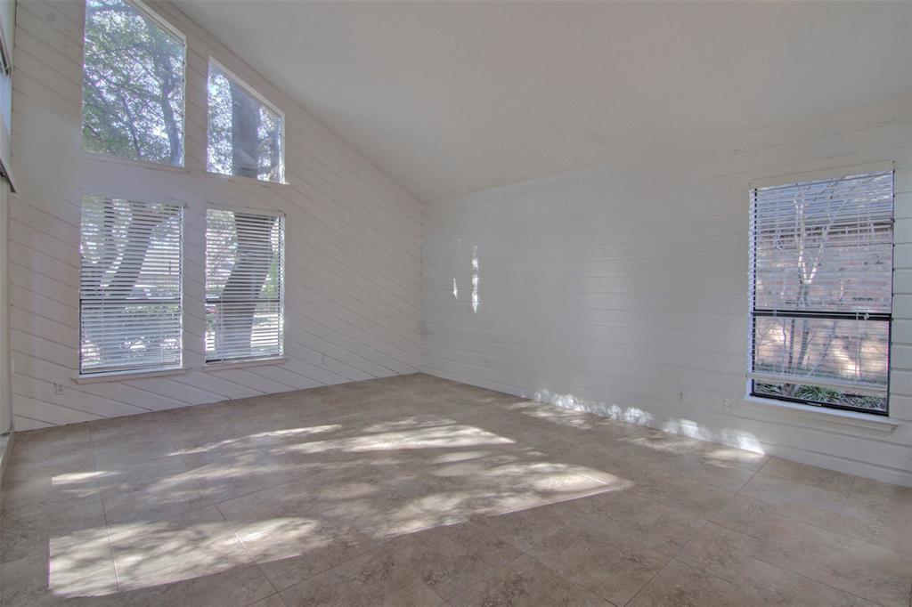 14822 Sopras Circle Addison, TX 75001 - Photo 11 of 33 a view of an empty room with windows