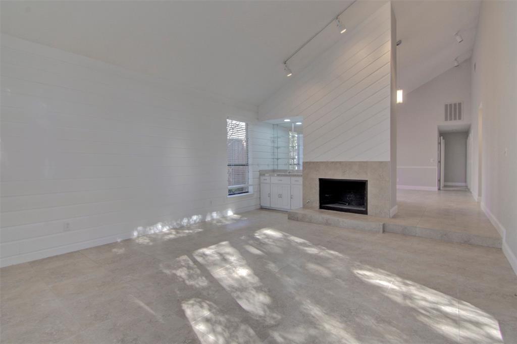 14822 Sopras Circle Addison, TX 75001 - Photo 12 of 33 a view of empty room with a fireplace