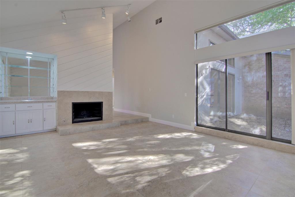 14822 Sopras Circle Addison, TX 75001 - Photo 13 of 33 a view of a livingroom with a fireplace