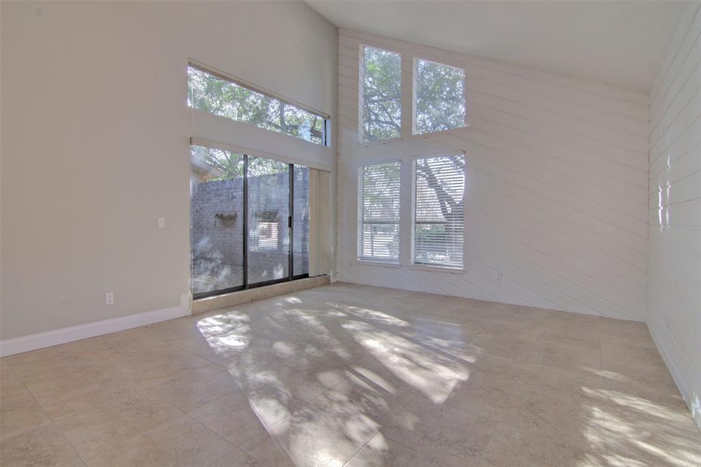 14822 Sopras Circle Addison, TX 75001 - Photo 14 of 33 an empty room with windows and closet