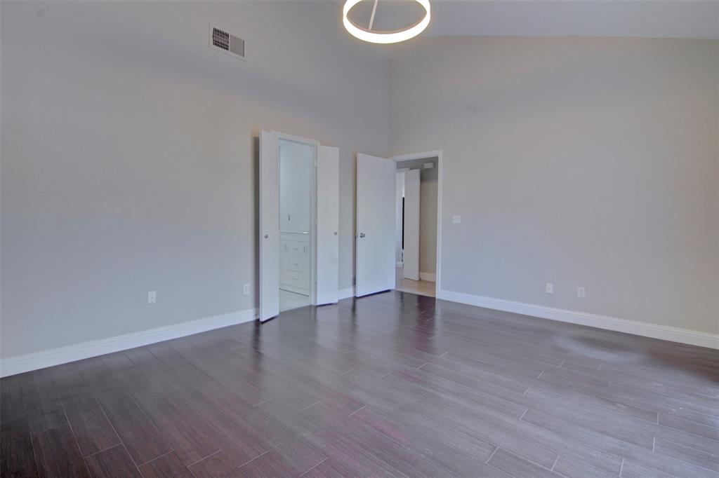 14822 Sopras Circle Addison, TX 75001 - Photo 24 of 33 a view of an empty room with wooden floor and window