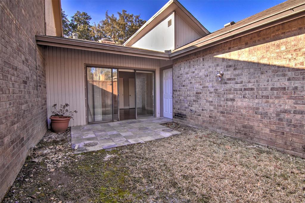 14822 Sopras Circle Addison, TX 75001 - Photo 30 of 33 a view of a porch with a table and chairs