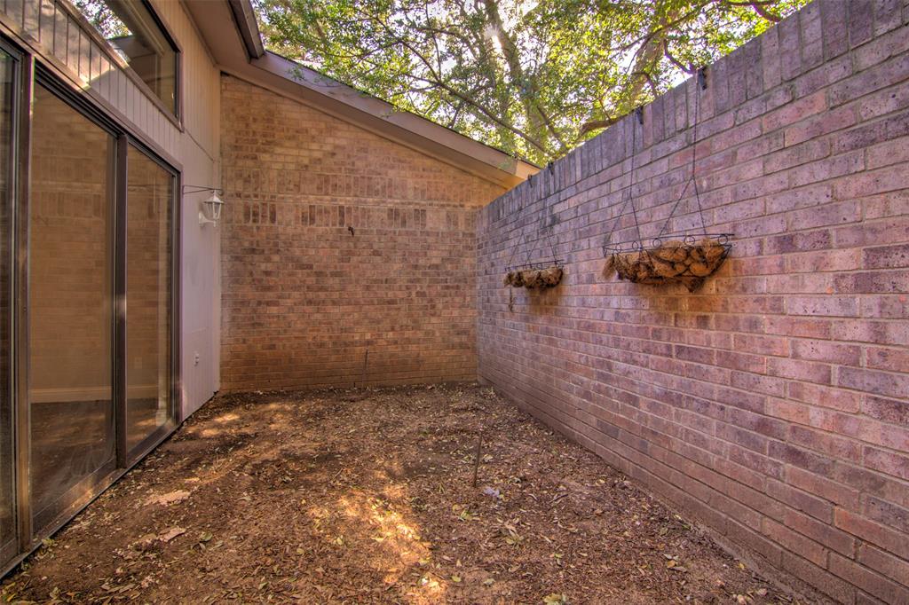 14822 Sopras Circle Addison, TX 75001 - Photo 31 of 33 a view of a brick wall