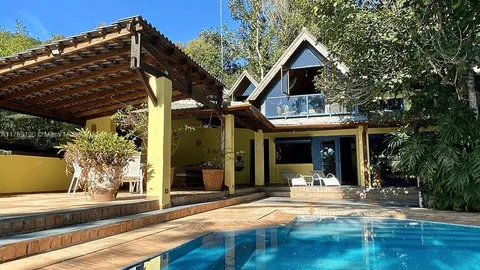 a view of a house with door and wooden floor