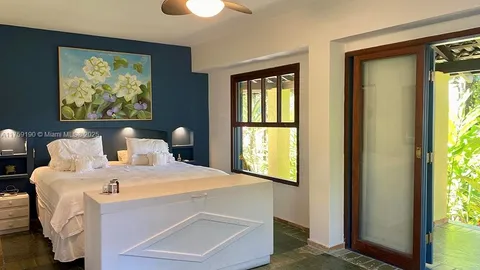 a room with a bed and a window