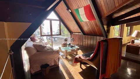 a view of balcony with furniture