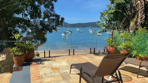 a view of a chairs and table in the patio