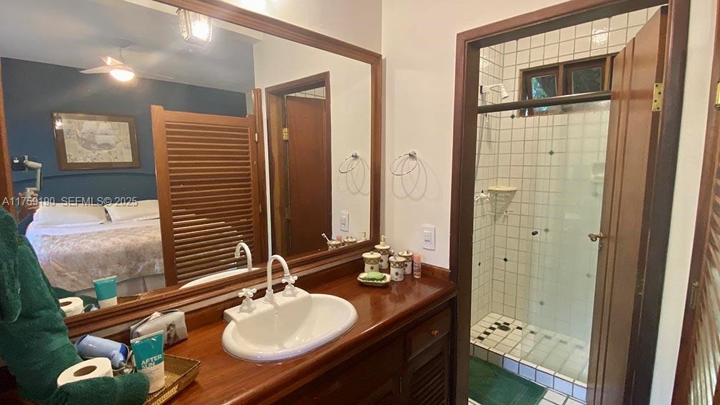 Praia Do Flamengo Saco Da Ribeira undefined, SP 0 - Photo 22 of 33 a bathroom with a sink vanity granite tub and shower