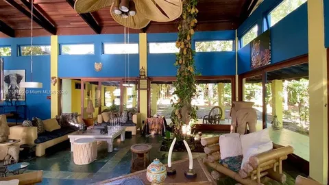 a room with lots of furniture and windows