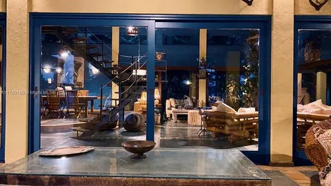 a view of a living room with entryway and living room