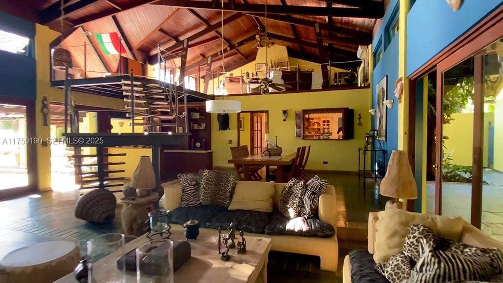 Praia Do Flamengo Saco Da Ribeira undefined, SP 0 - Photo 7 of 33 a living room with furniture and a floor to ceiling window