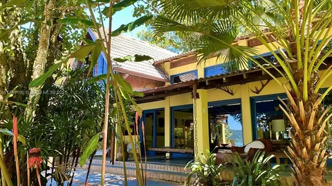 front view of a house with a tree