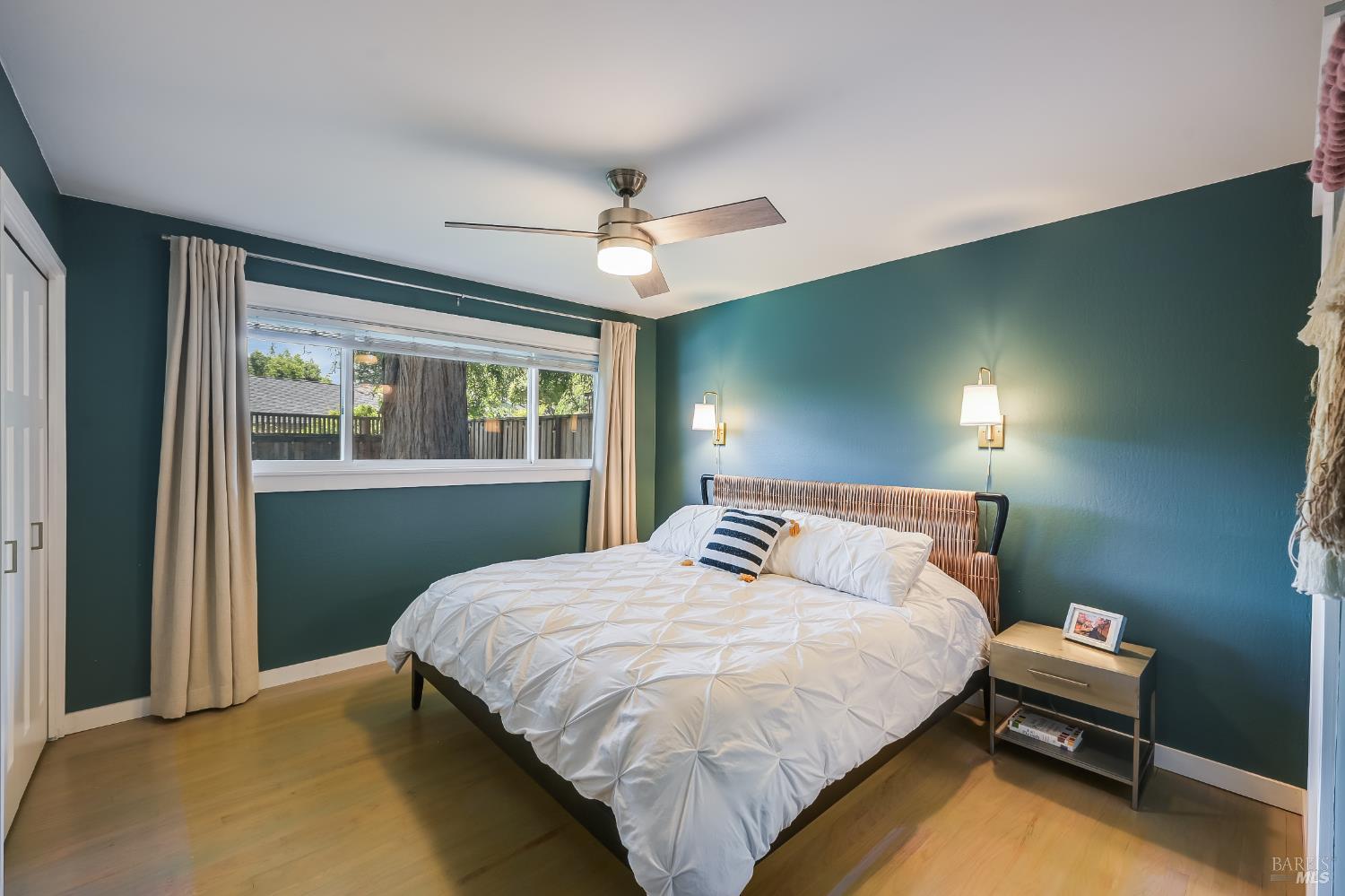 2009 Hidden Valley Drive Santa Rosa, CA 95404 - Photo 10 of 26 a bedroom with a bed and a chandelier