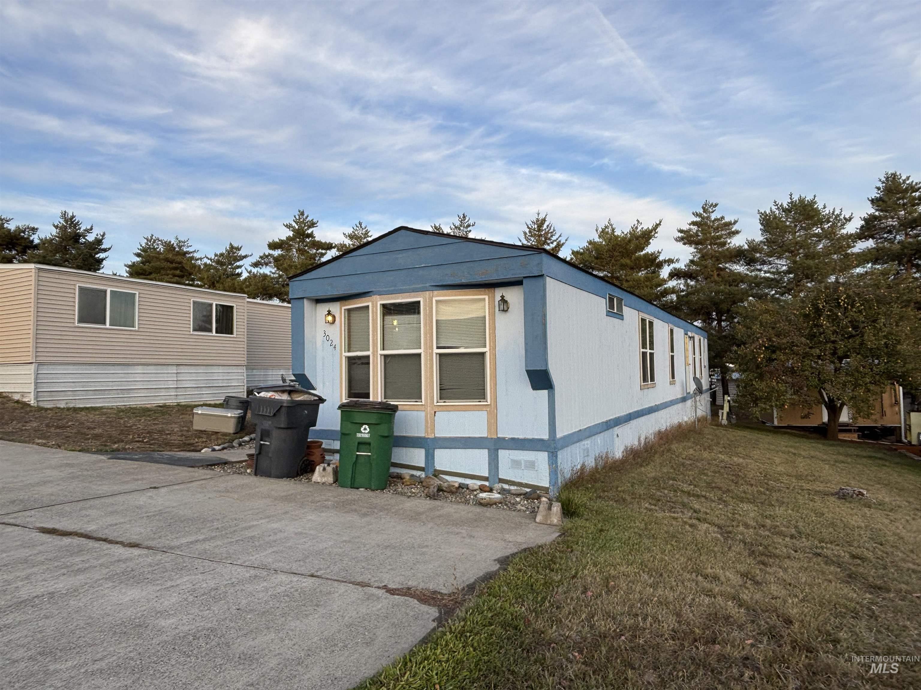 609 North Almon Street, Unit 3024 Moscow, ID 83843 - Photo 1 of 17 View of home's exterior with a yard