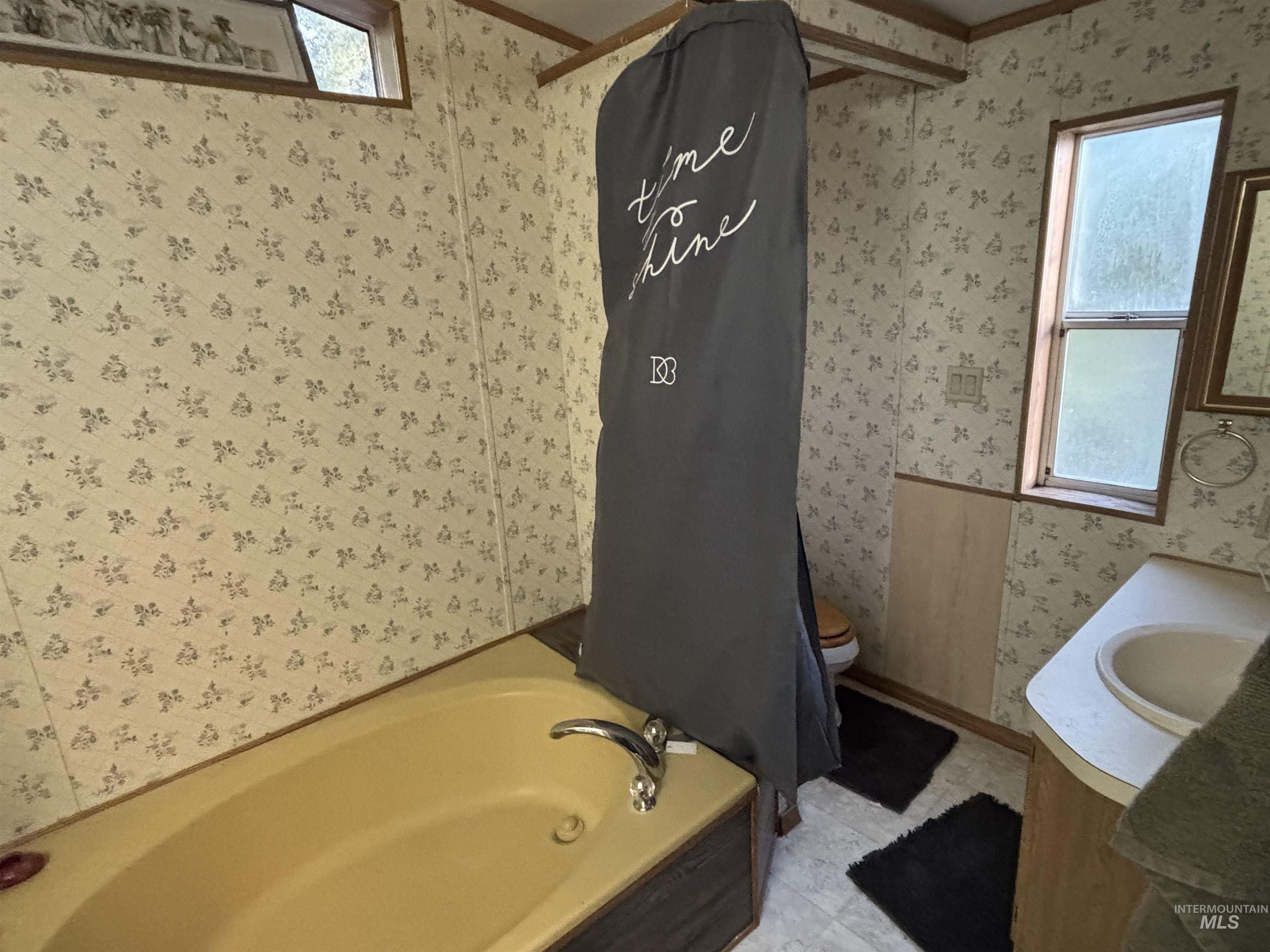 609 North Almon Street, Unit 3024 Moscow, ID 83843 - Photo 11 of 17 Bathroom with wallpapered walls and vanity