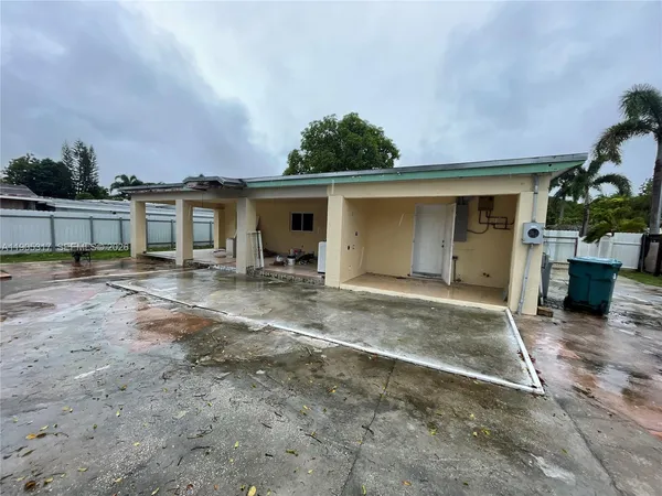 a view of an empty room with windows