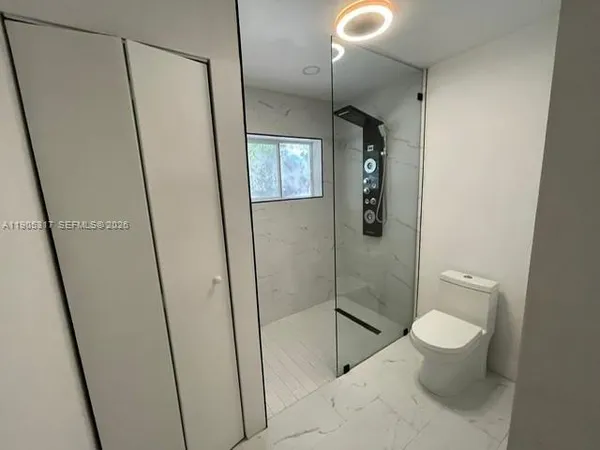 wooden floor in an empty room with a mirror