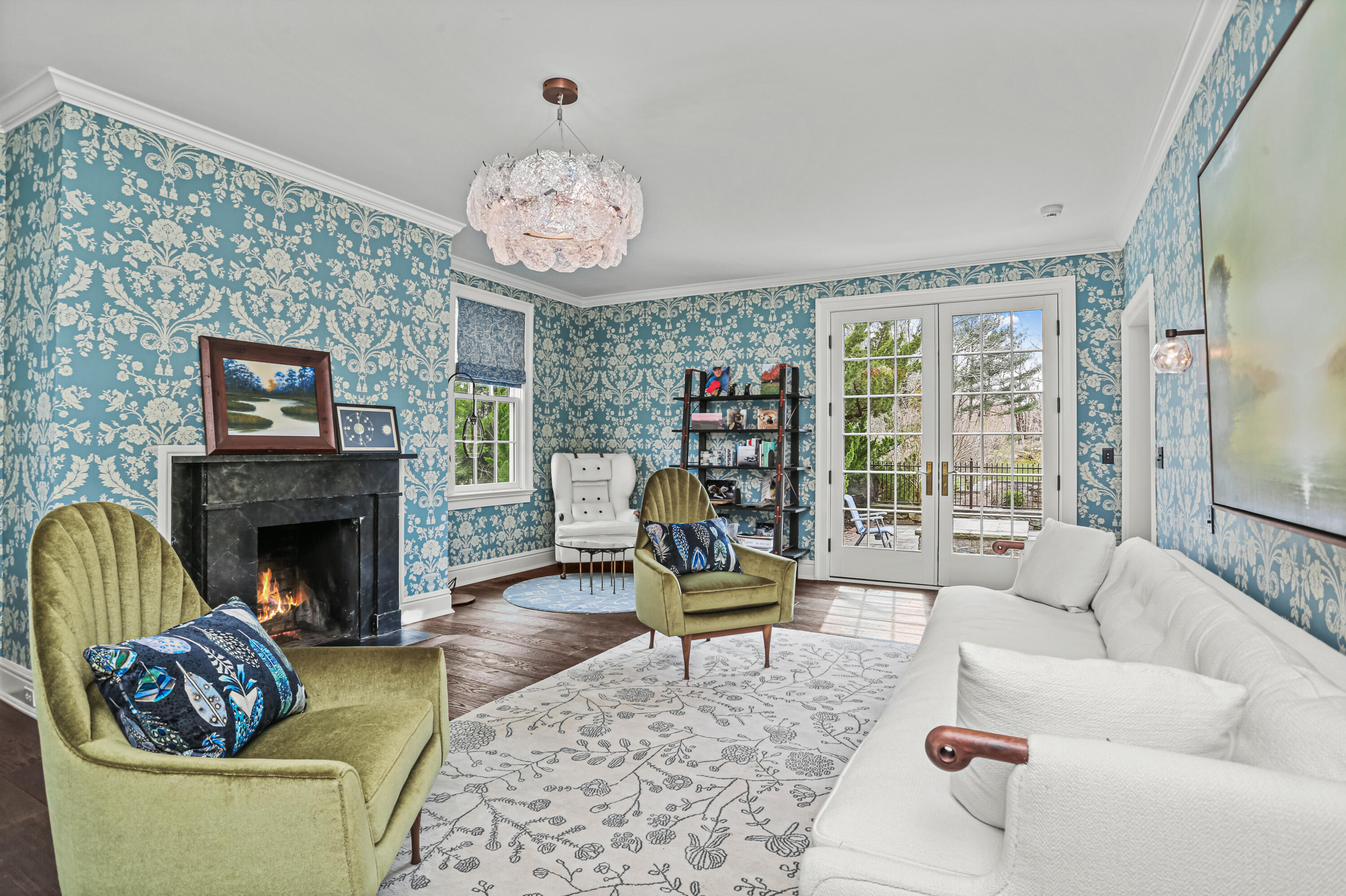 313 Stanwich Road Greenwich, CT 06830 - Photo 14 of 23 a living room with furniture a fireplace and a large mirror