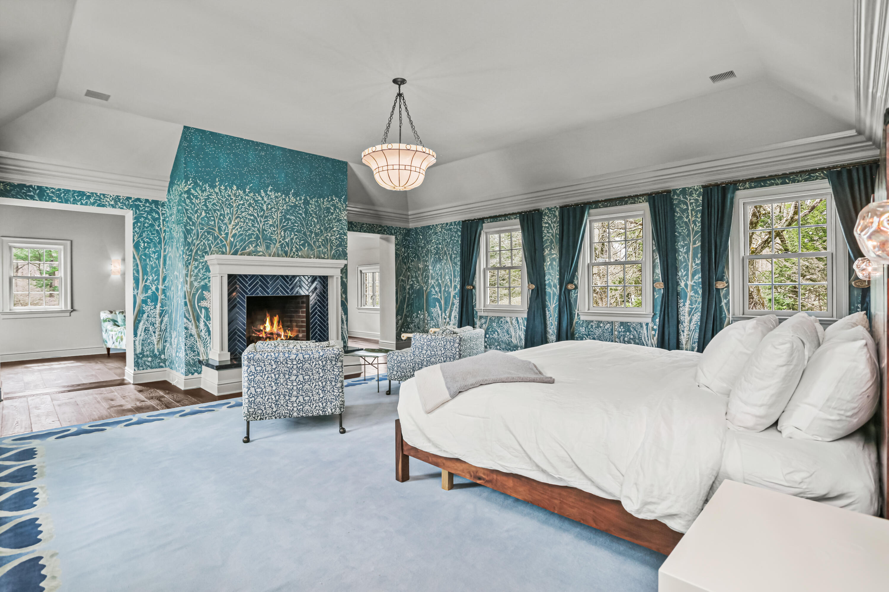 313 Stanwich Road Greenwich, CT 06830 - Photo 15 of 23 a bed room with a bed and a fireplace