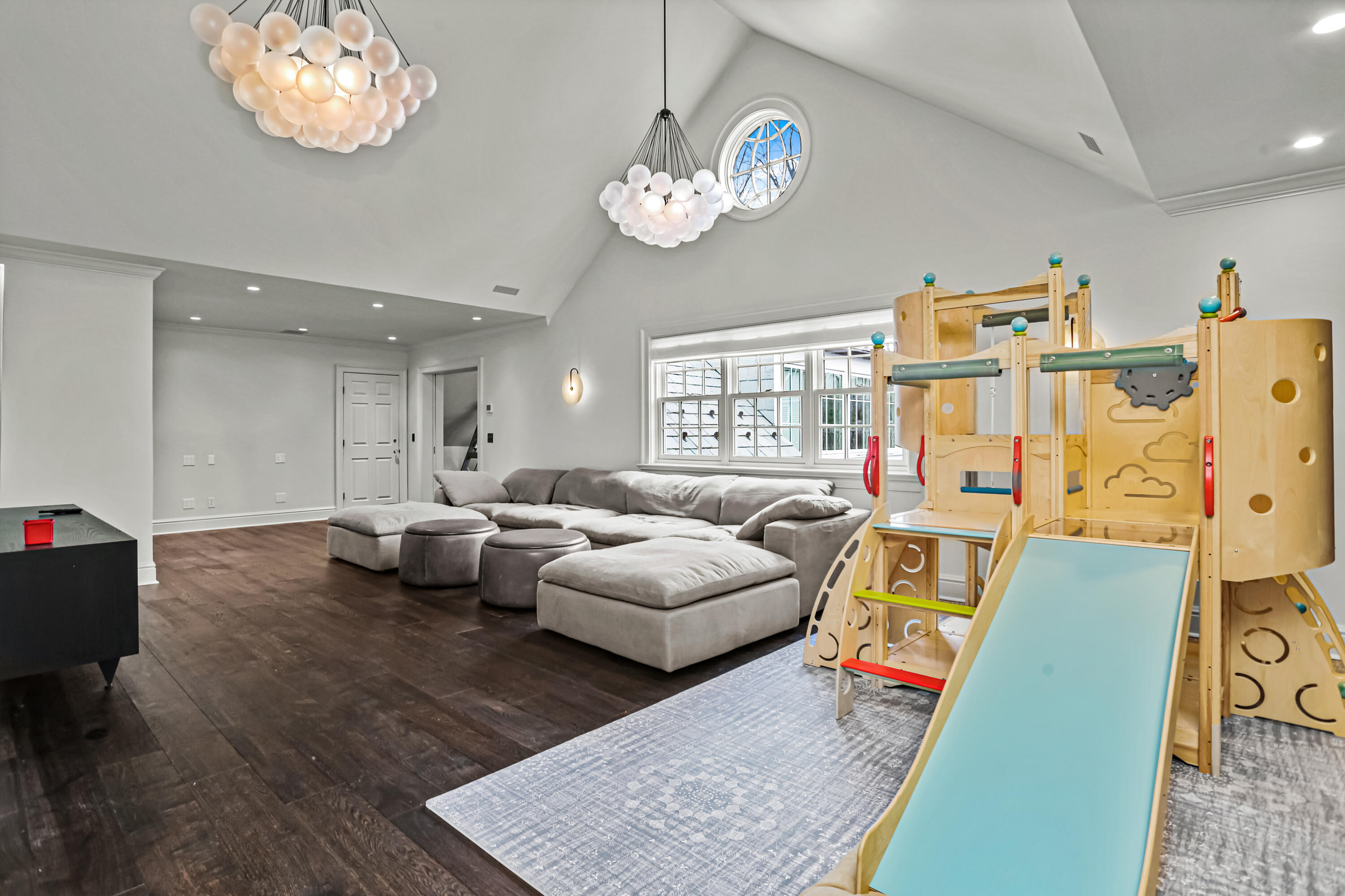 313 Stanwich Road Greenwich, CT 06830 - Photo 19 of 23 a living room with furniture and a chandelier