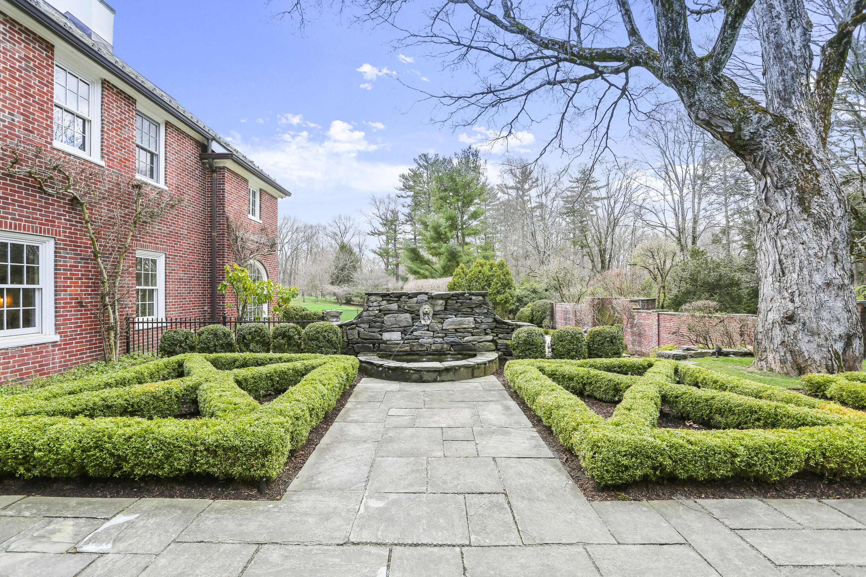 313 Stanwich Road Greenwich, CT 06830 - Photo 2 of 23 a view of yard with outdoor seating and plants
