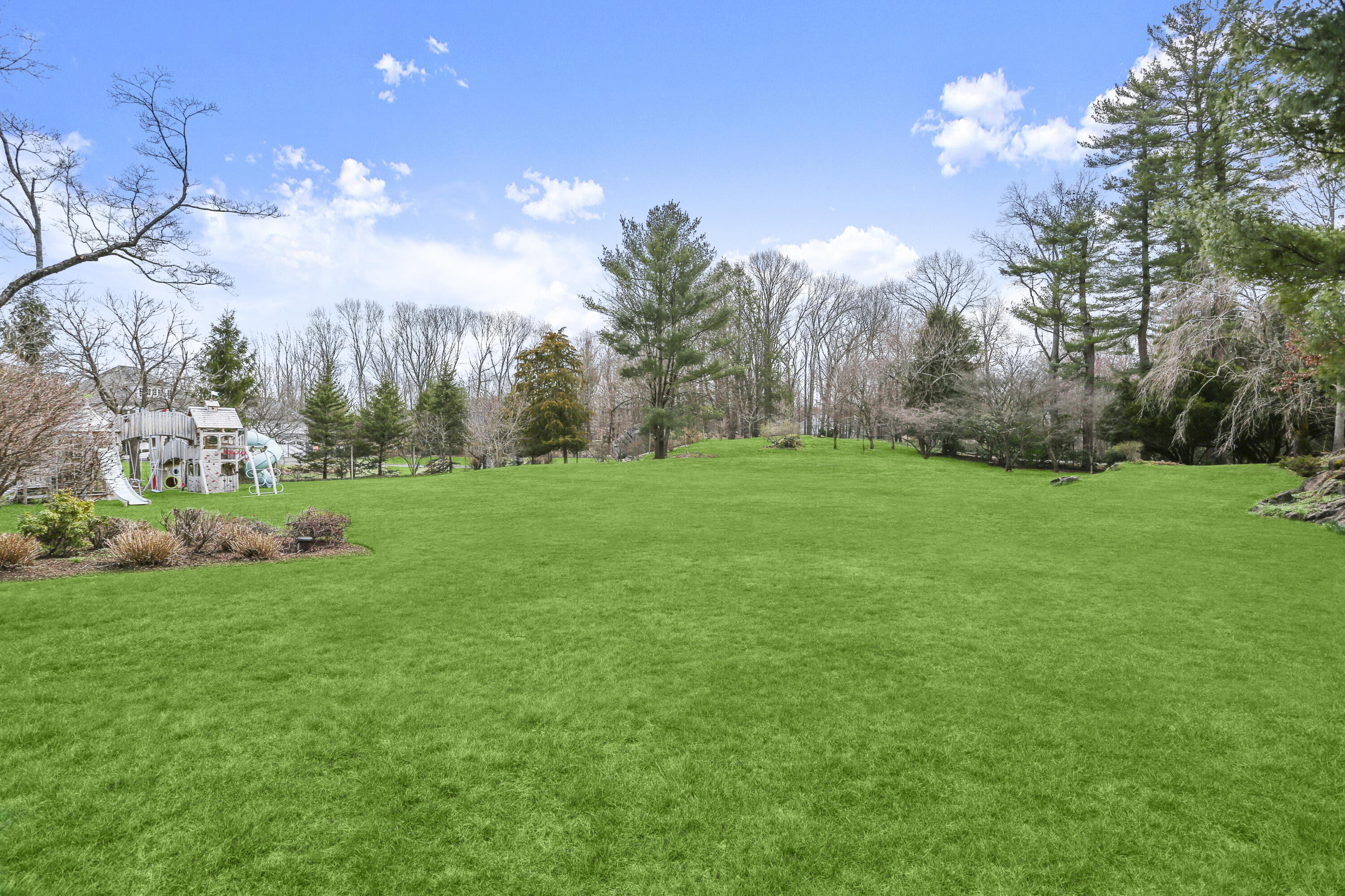 313 Stanwich Road Greenwich, CT 06830 - Photo 22 of 23 a view of a yard with a house