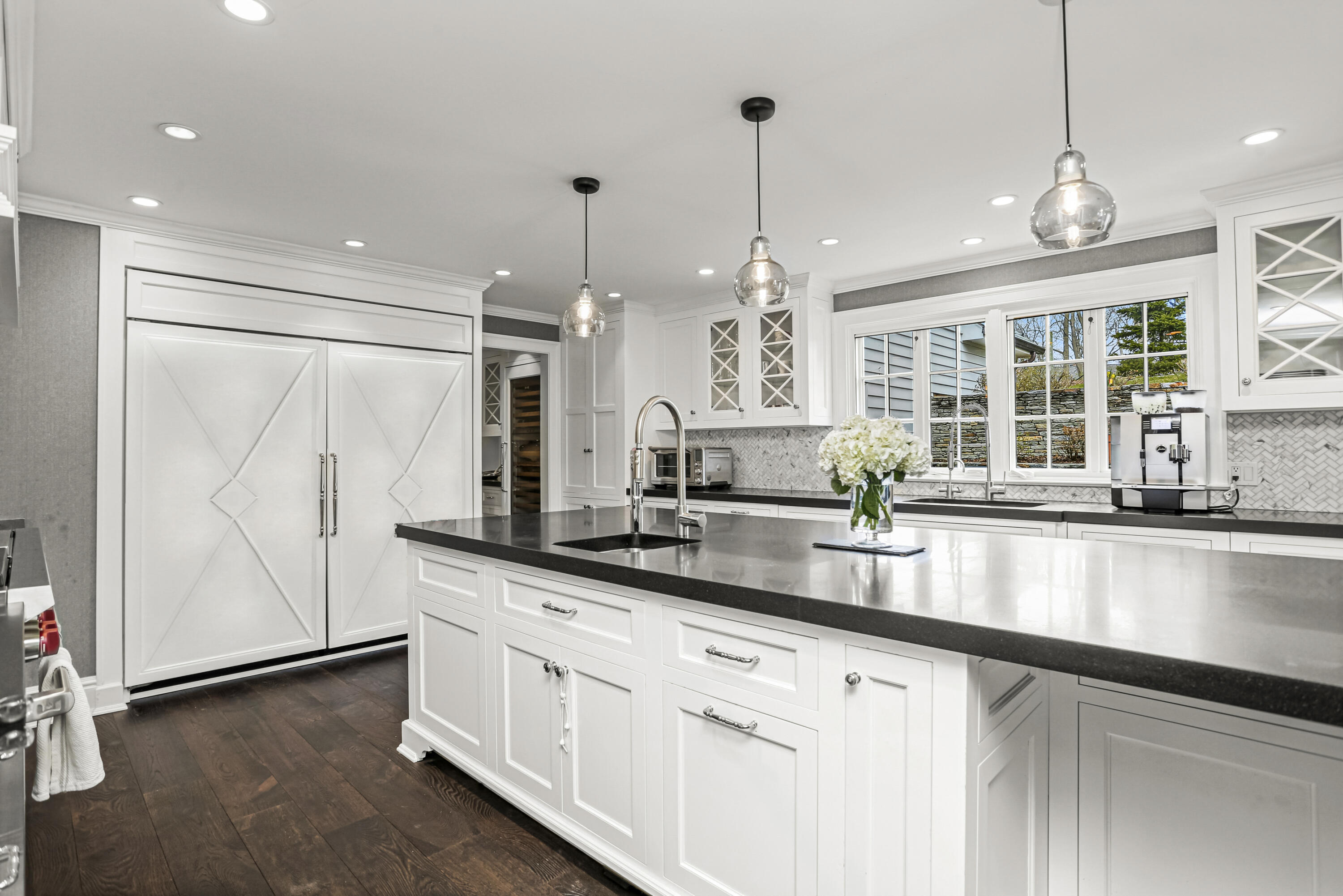 313 Stanwich Road Greenwich, CT 06830 - Photo 9 of 23 a large kitchen with granite countertop a sink and a window