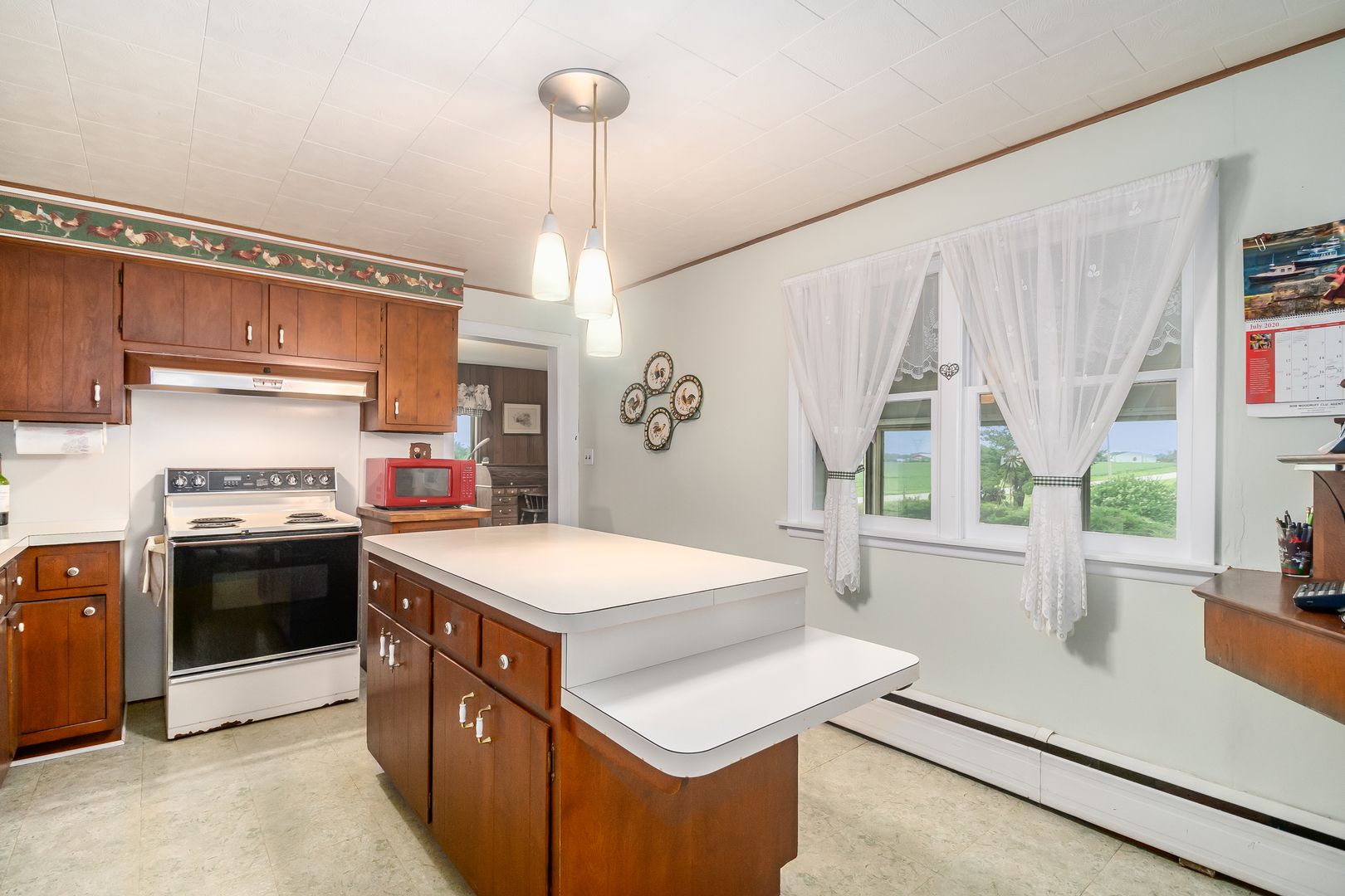 15525 West Hoff Road Manhattan, IL 60442 - Photo 10 of 30 a kitchen that has a sink a stove and a refrigerator