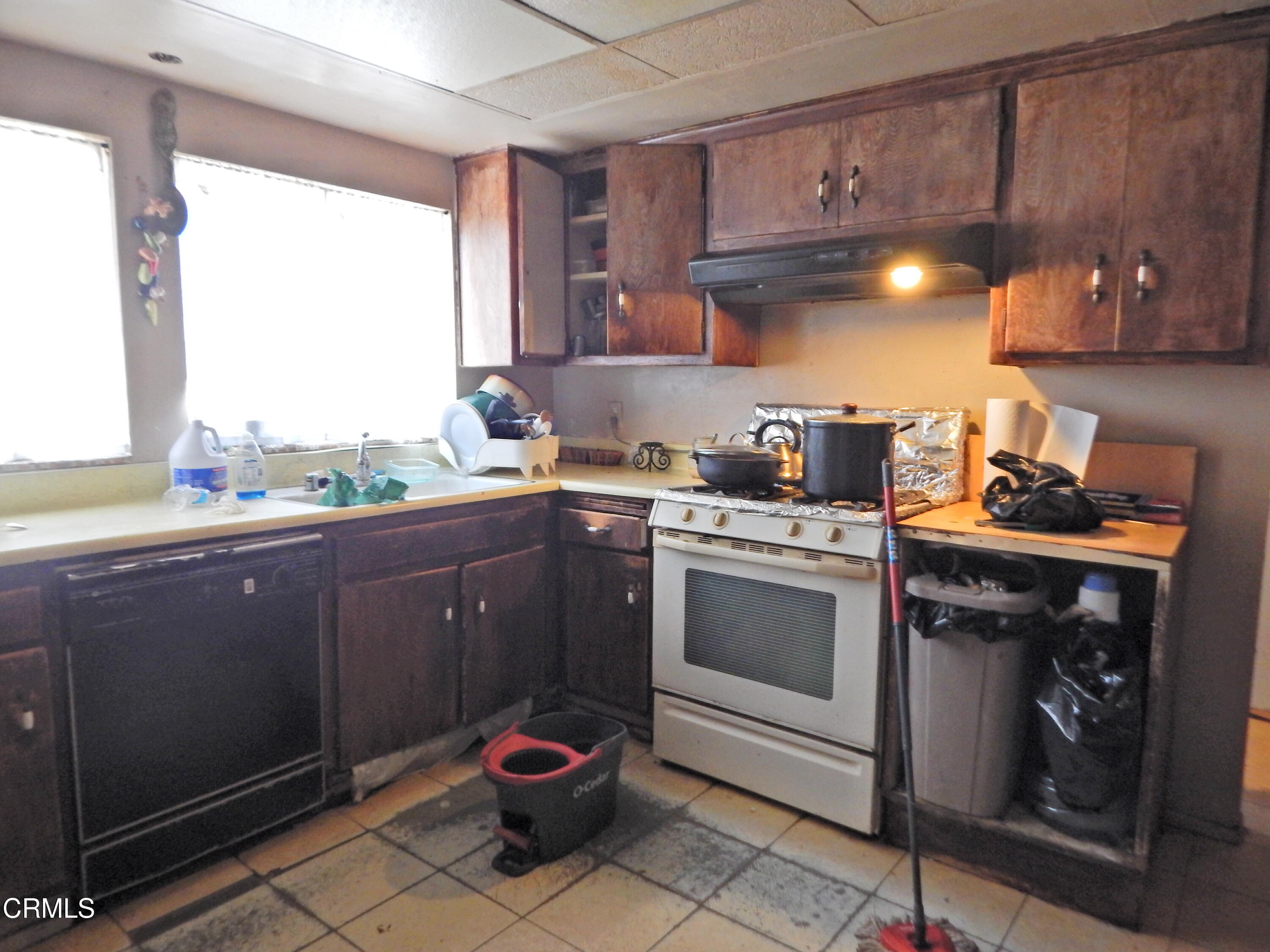 2746 Friedrich Road Oxnard, CA 93036 - Photo 11 of 36 a kitchen with a stove and a cabinets