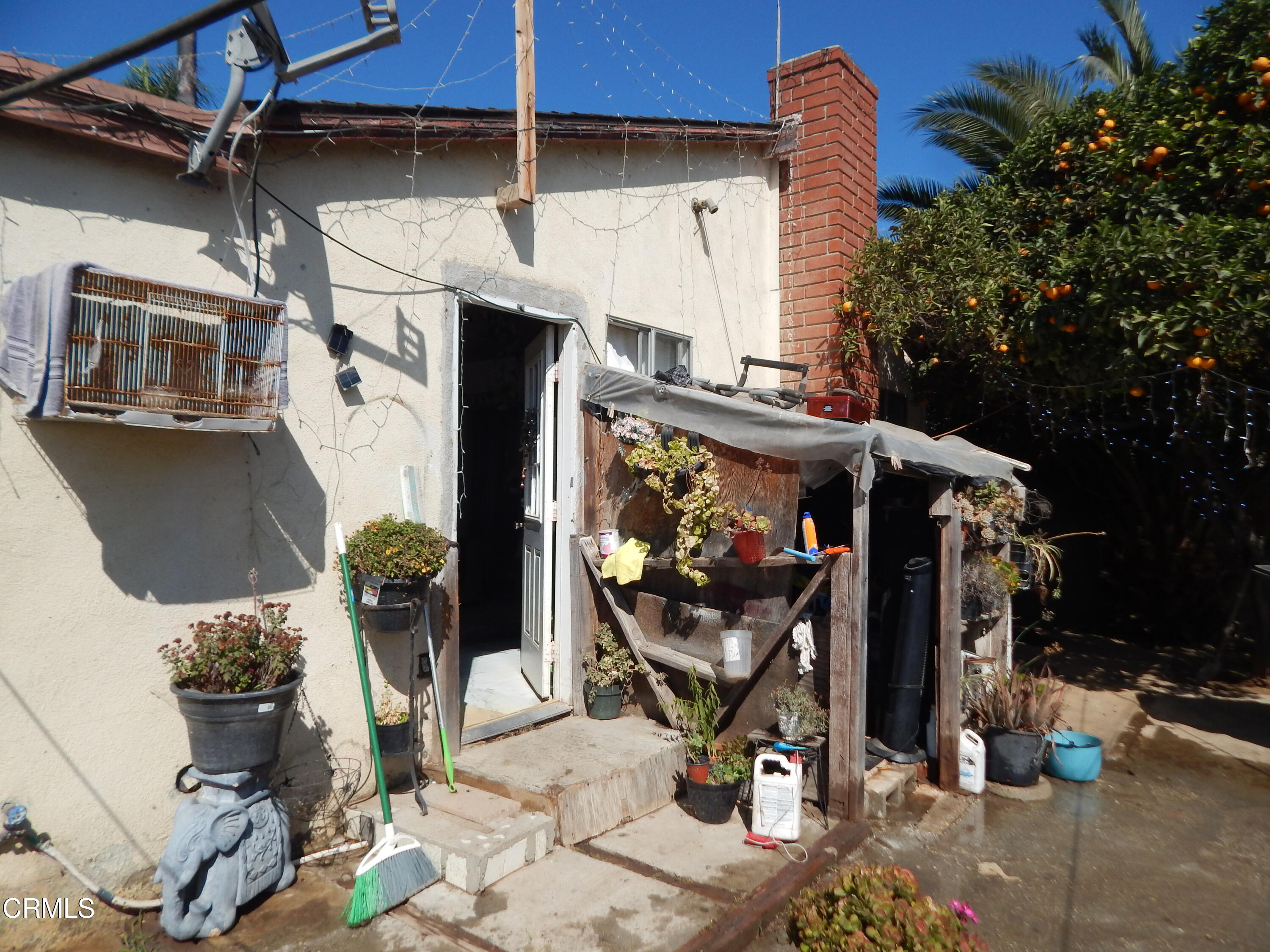 2746 Friedrich Road Oxnard, CA 93036 - Photo 15 of 36 a view of a patio with table and chairs and potted plants