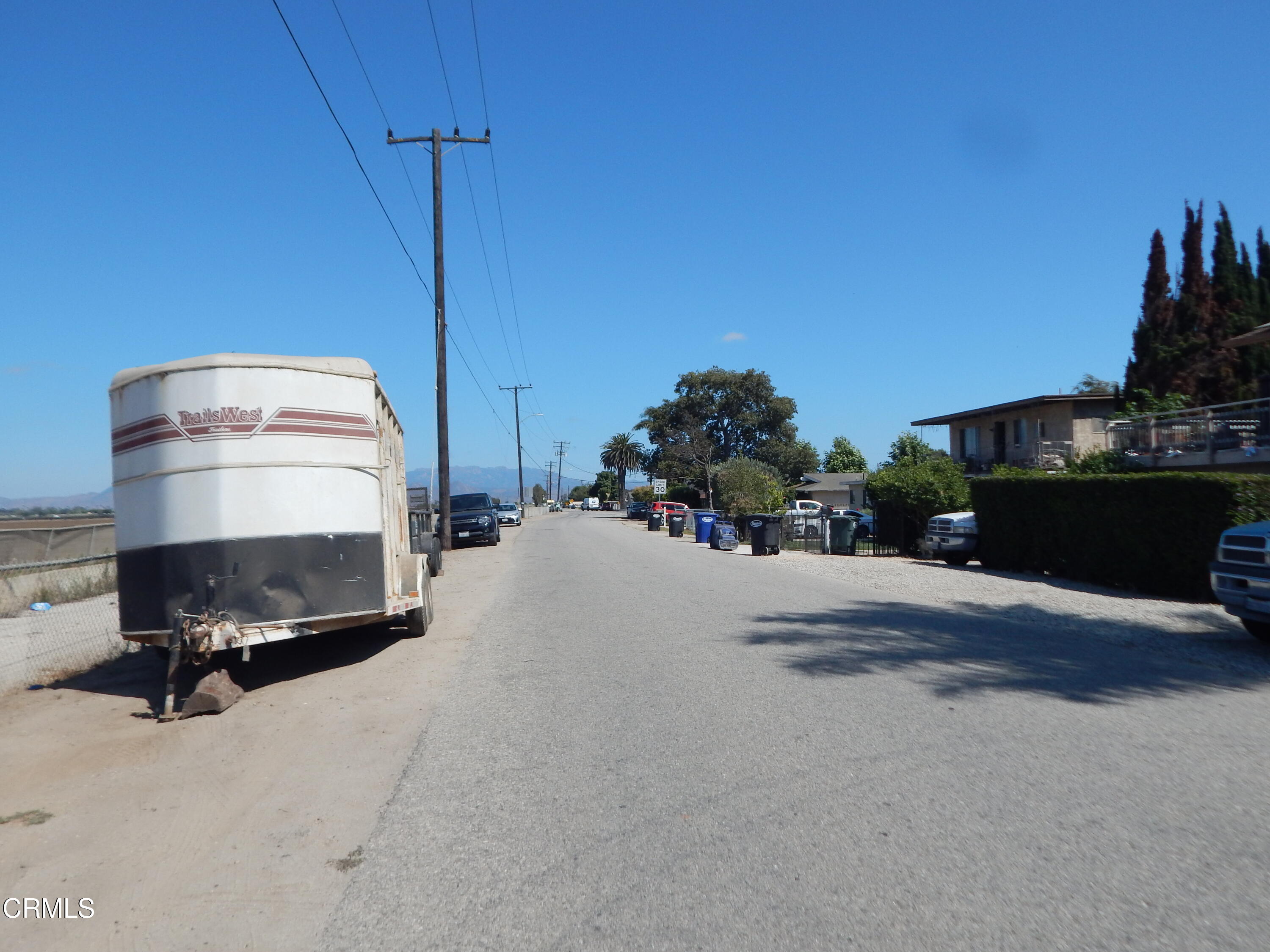 2746 Friedrich Road Oxnard, CA 93036 - Photo 34 of 36 a bedroom with a bed and a potted plant on the side