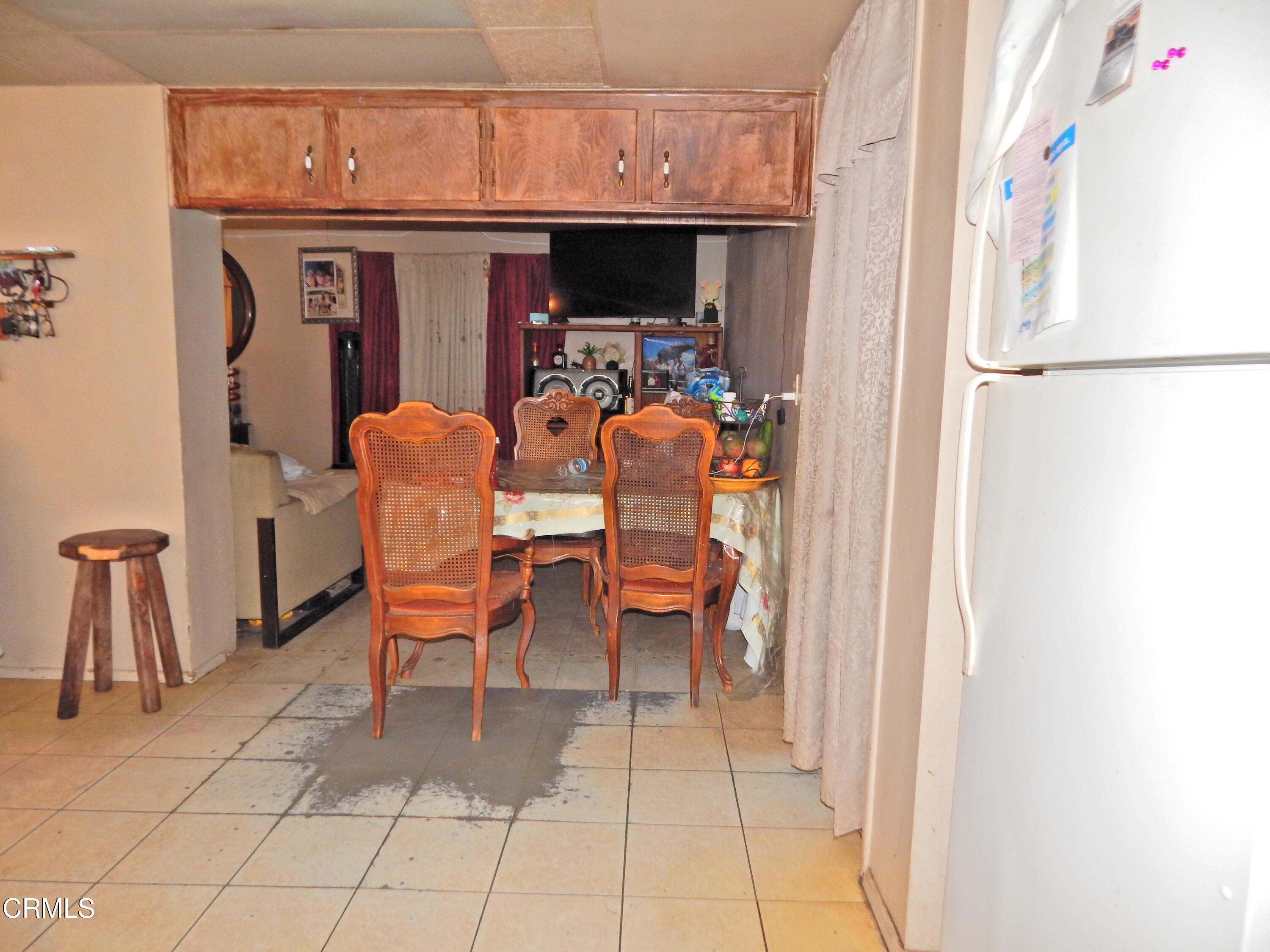 2746 Friedrich Road Oxnard, CA 93036 - Photo 9 of 36 a dining room with furniture and a kitchen