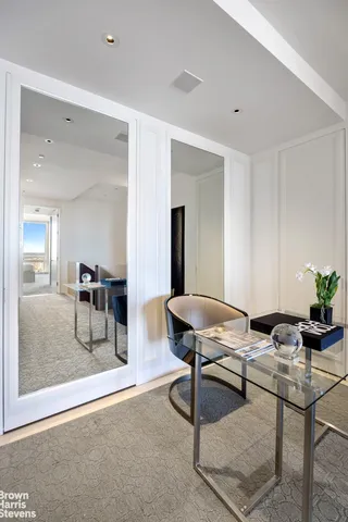 a workspace with furniture and wooden floor