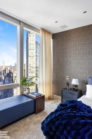 a spacious bedroom with a bed and a couch