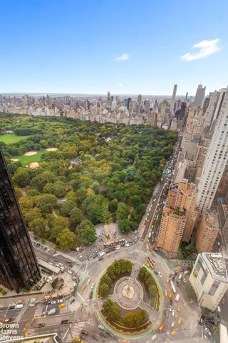 a view of a swimming pool with a yard